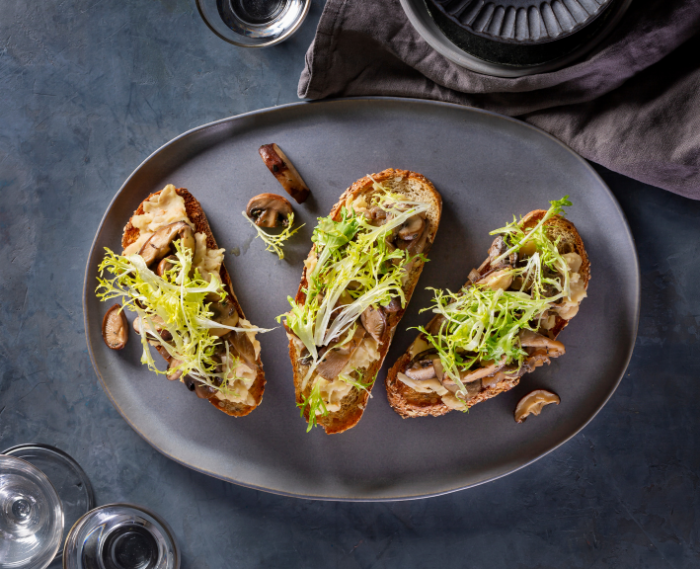 Mushroom White Bean Toasts with Frisée